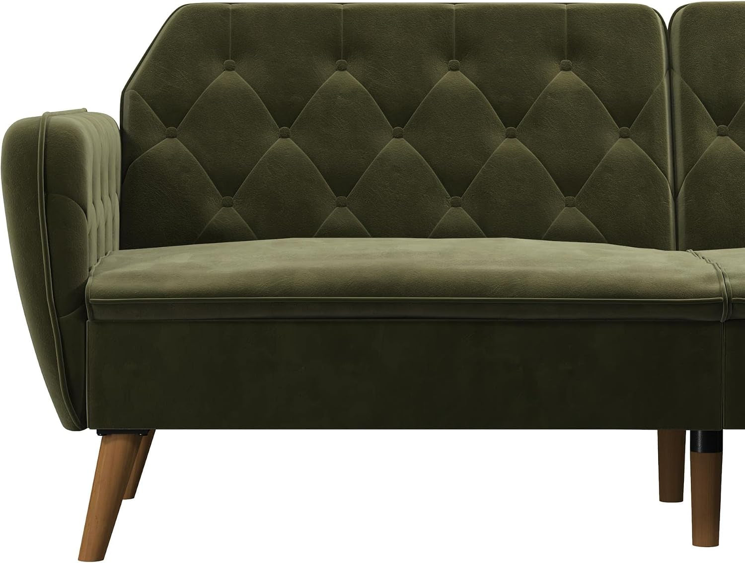 Close side view of the left half of a green velvet tufted futon with angled wooden legs.