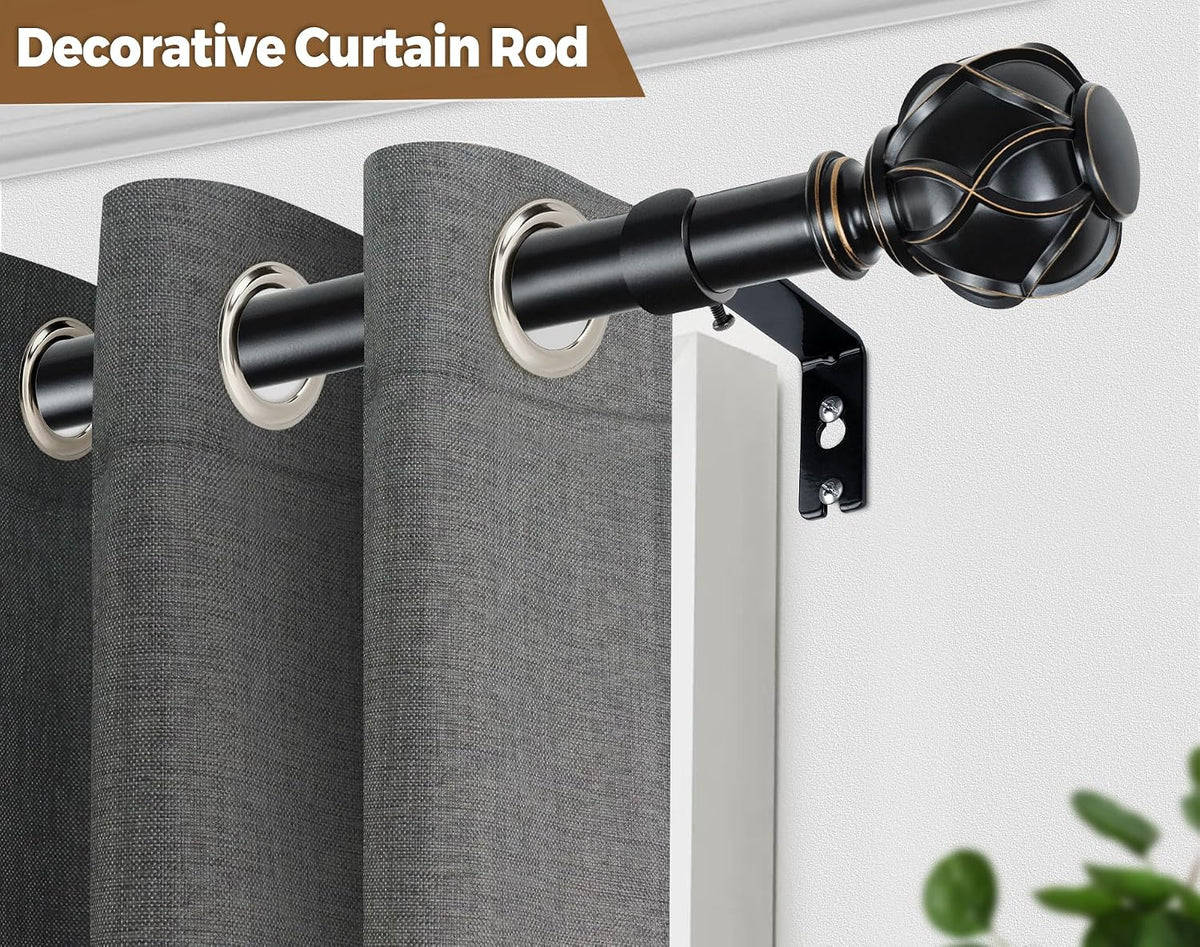 Close-up of a black decorative curtain rod with ornate finial and gray grommeted curtain hung over a window frame.