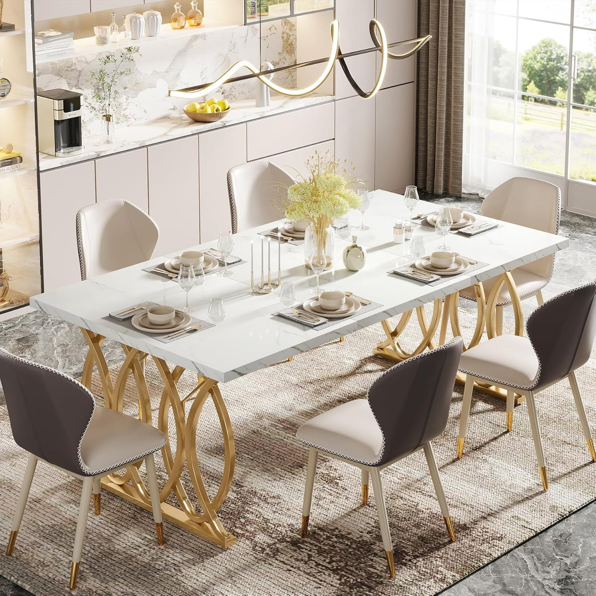 Angled overhead view of a 63-inch white faux marble table with gold circular leg bases, set with multiple place settings.