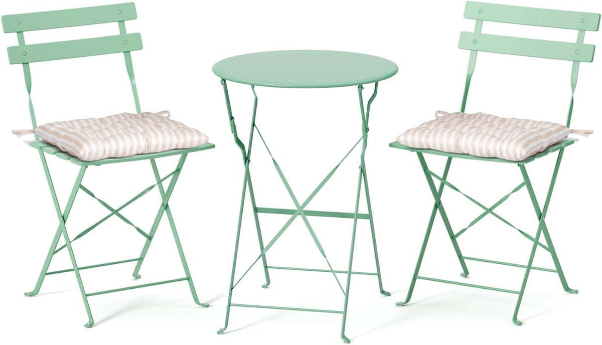 Mint green bistro table and two mint chairs, each chair topped with a beige-striped tufted seat cushion.