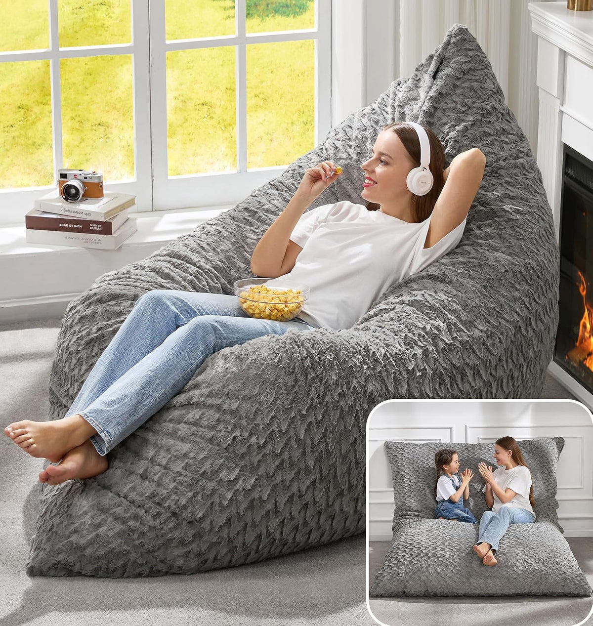 Woman wearing headphones and eating popcorn on a textured medium gray beanbag lounger; inset shows it laid flat with a child.