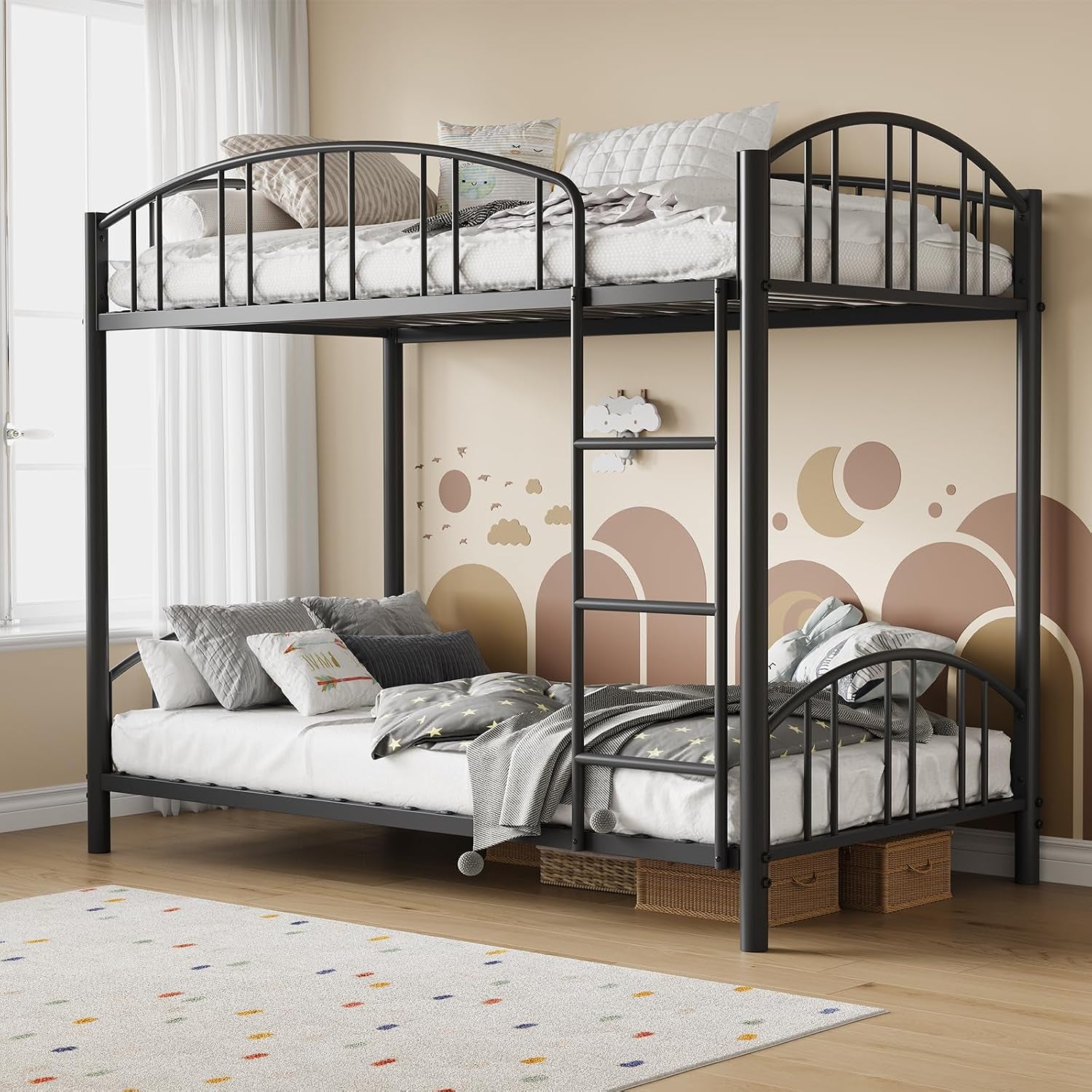 Dark gray metal bunk bed in a beige bedroom with ladder at center and storage baskets under the lower bed.