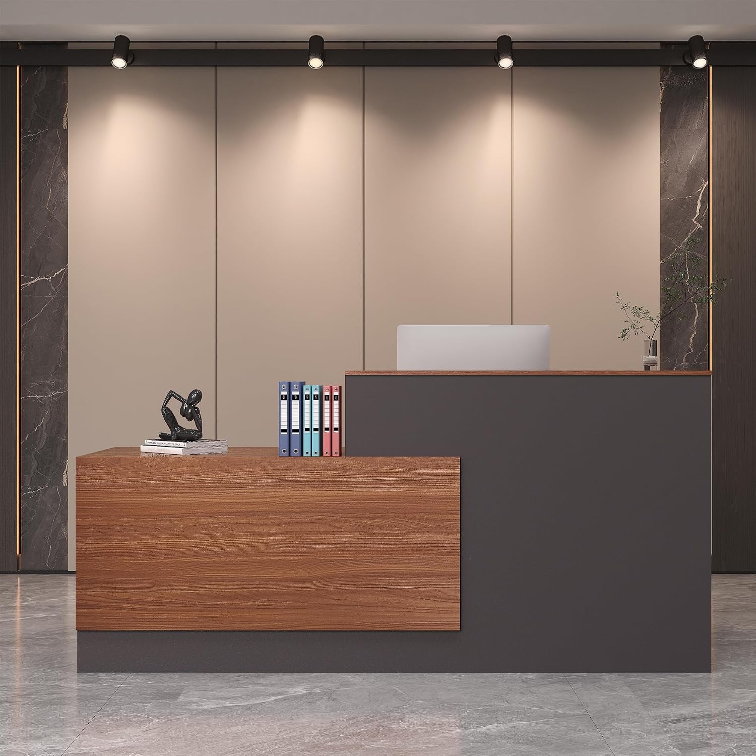 Close front view of a slate gray desk with a wood-grain walnut return and track lighting above
