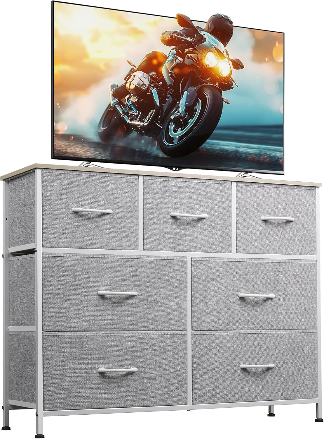 Front view of dresser with light gray fabric drawers and a light wood top, TV positioned above