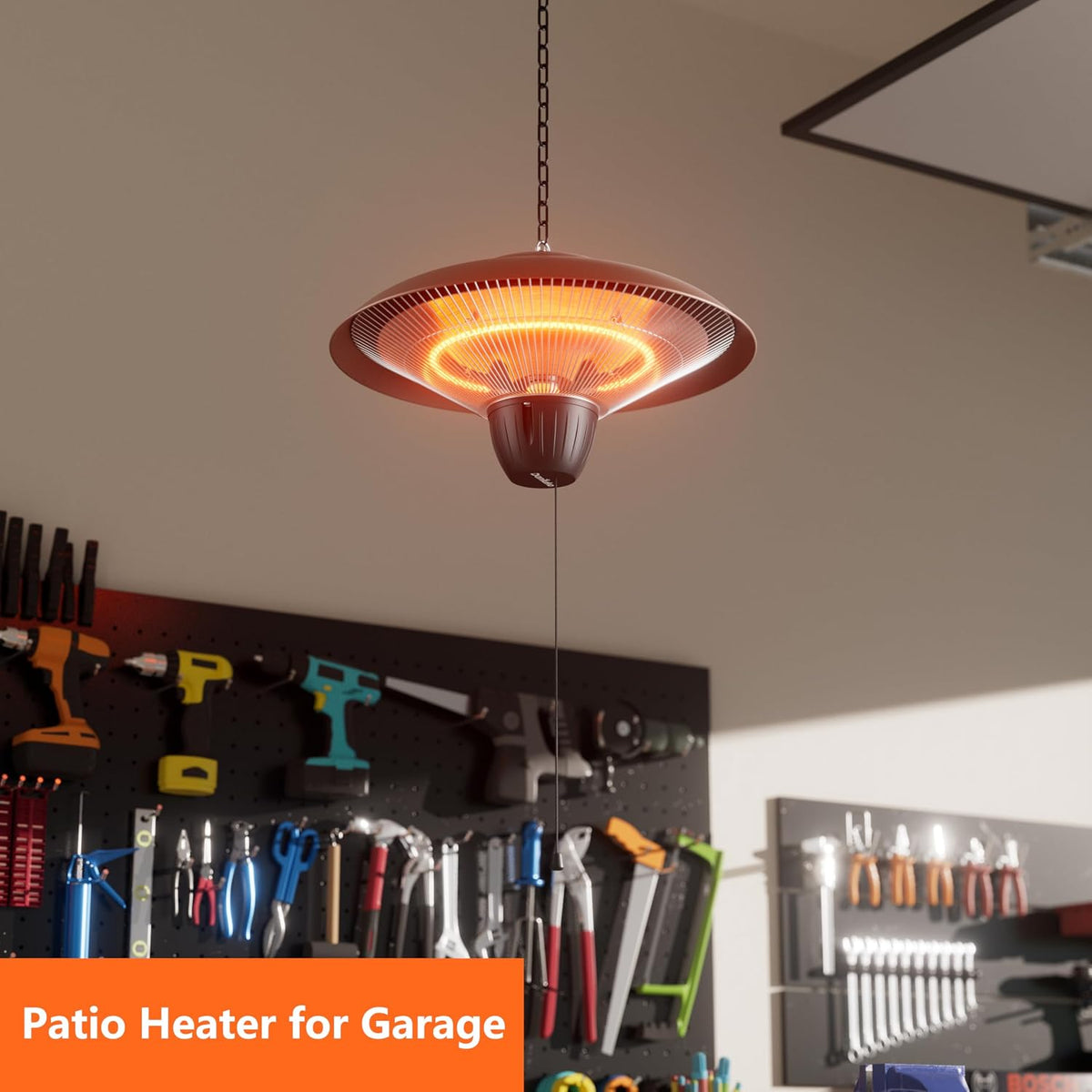 Hanging infrared heater illuminated in a garage workspace with tools on the wall behind, angled perspective