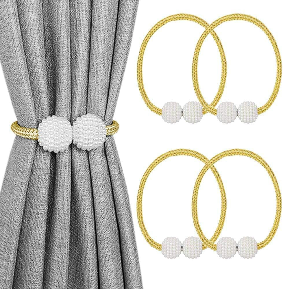 Gold braided magnetic curtain tiebacks with white pearl-like balls displayed on a gray curtain and paired extras