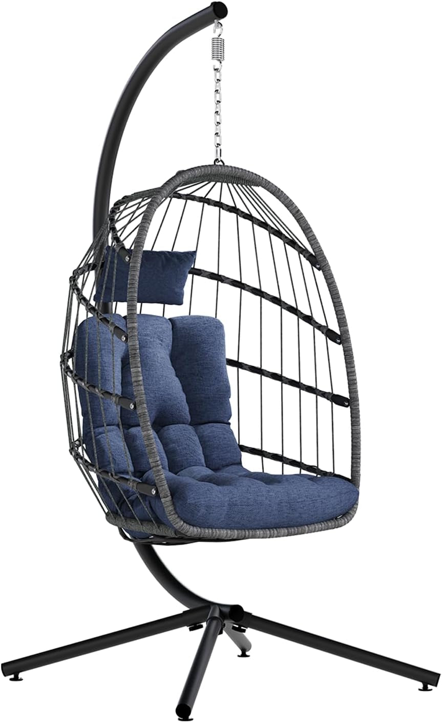 Dark grey frame egg chair with blue tufted seat cushion and matching head pillow on stand