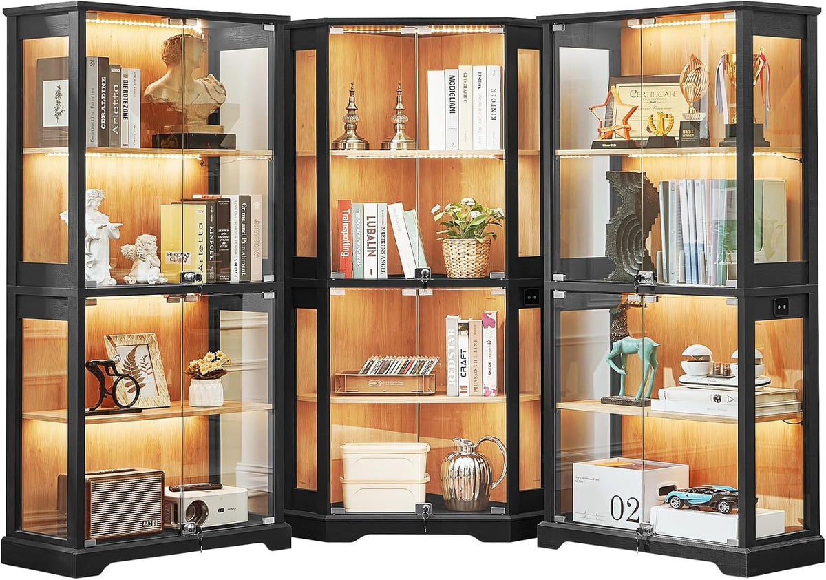 Three connected black-framed glass display cabinets with warm wood interiors and lit shelves, filled with décor.