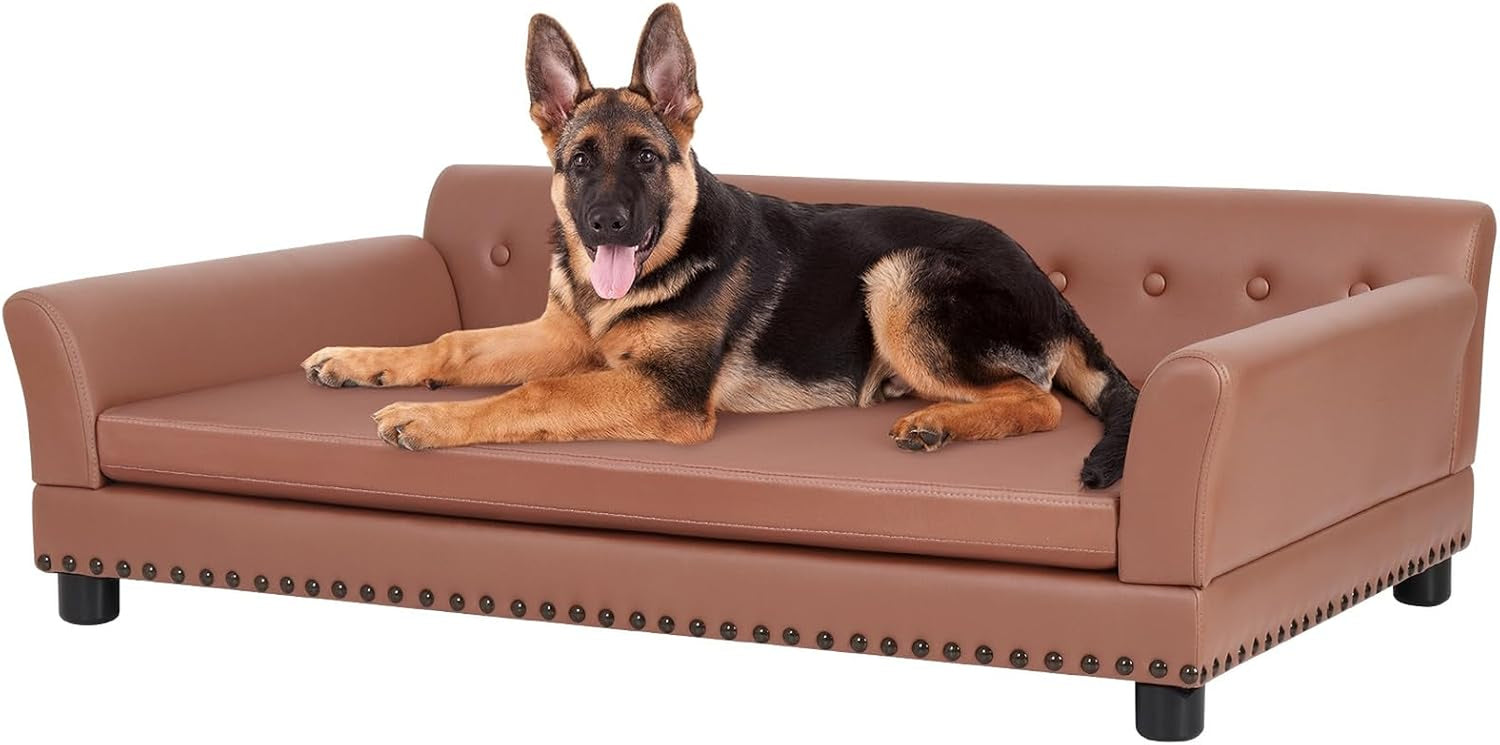 Brown leather dog sofa on white background with a German shepherd lying on the cushion.