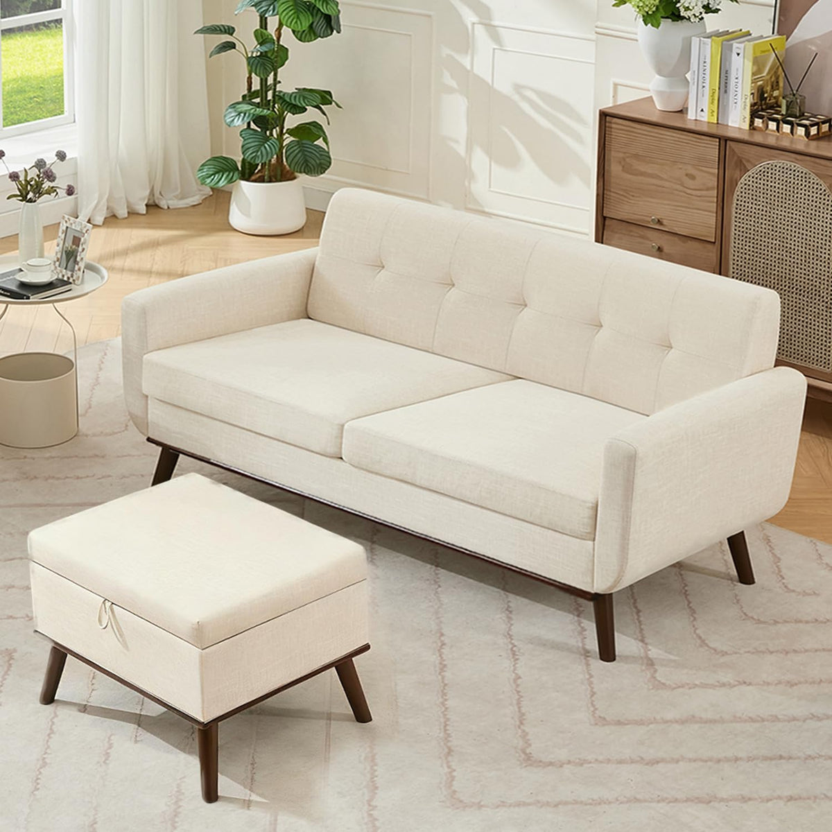 Angled view of a cream loveseat with tufted back and matching ottoman in a cozy styled room.