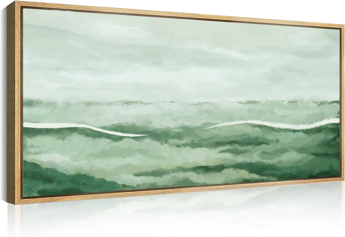 Framed horizontal canvas showing soft green abstract landscape with white brushstroke, shown at an angle.