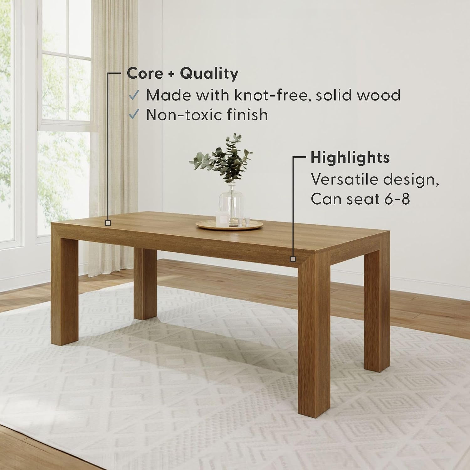 Studio shot of the pine table on a rug with a small vase, shown against a light wall.