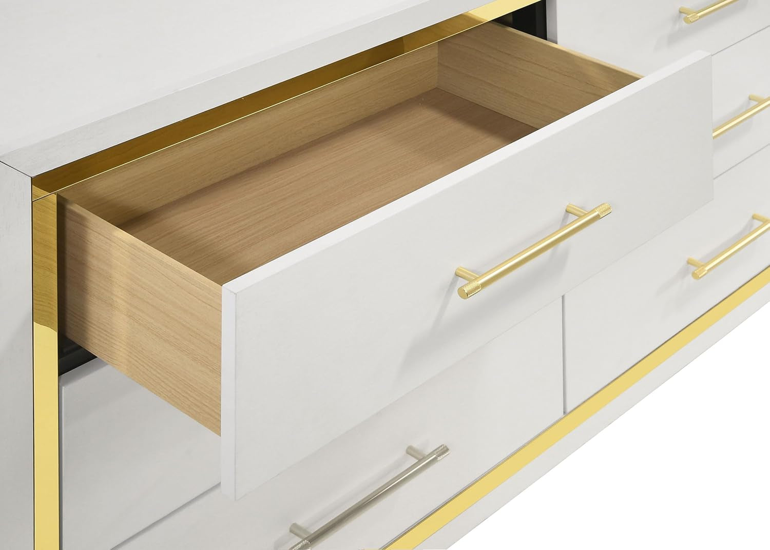 Partial dresser front with one drawer open, showing gold bar handles and light wood drawer interior.
