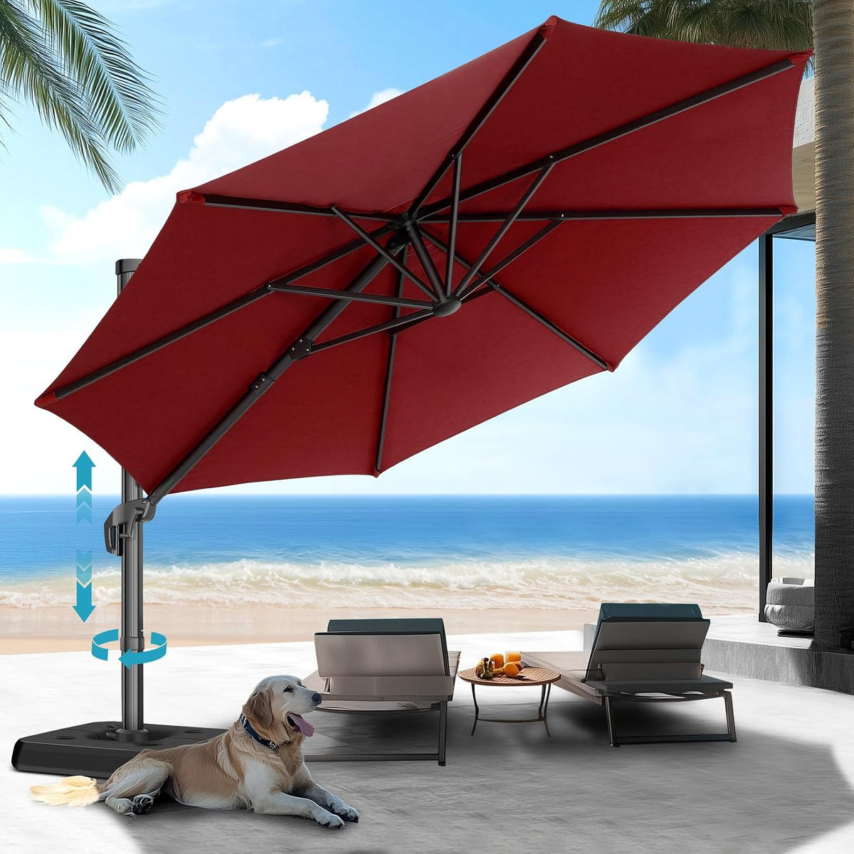 Red offset umbrella shading two lounge chairs with ocean in background and a dog on the patio