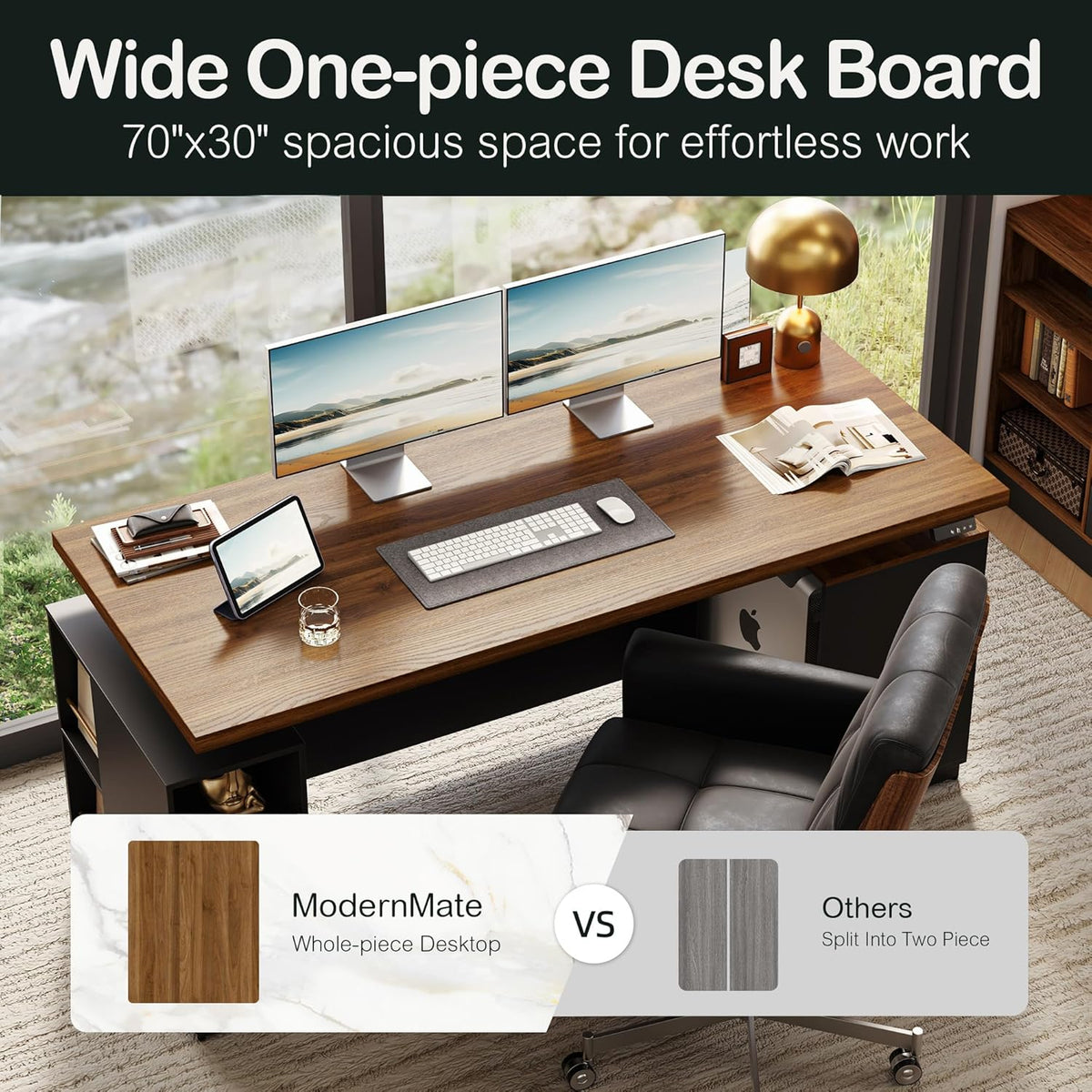 Angled overhead view of wide walnut desktop with dual monitors, lamp, keyboard and chair showing a single-piece surface.
