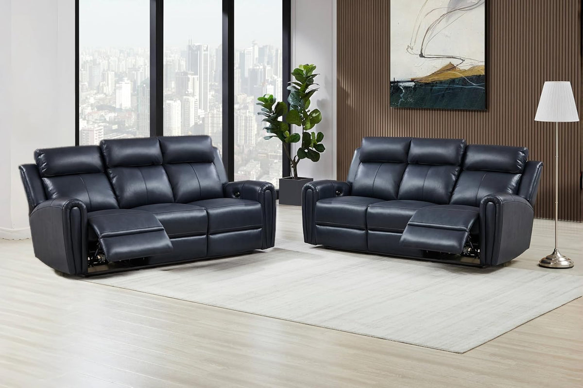 Two dark blue leather reclining sofa and loveseat in a bright room, both footrests extended on a light rug