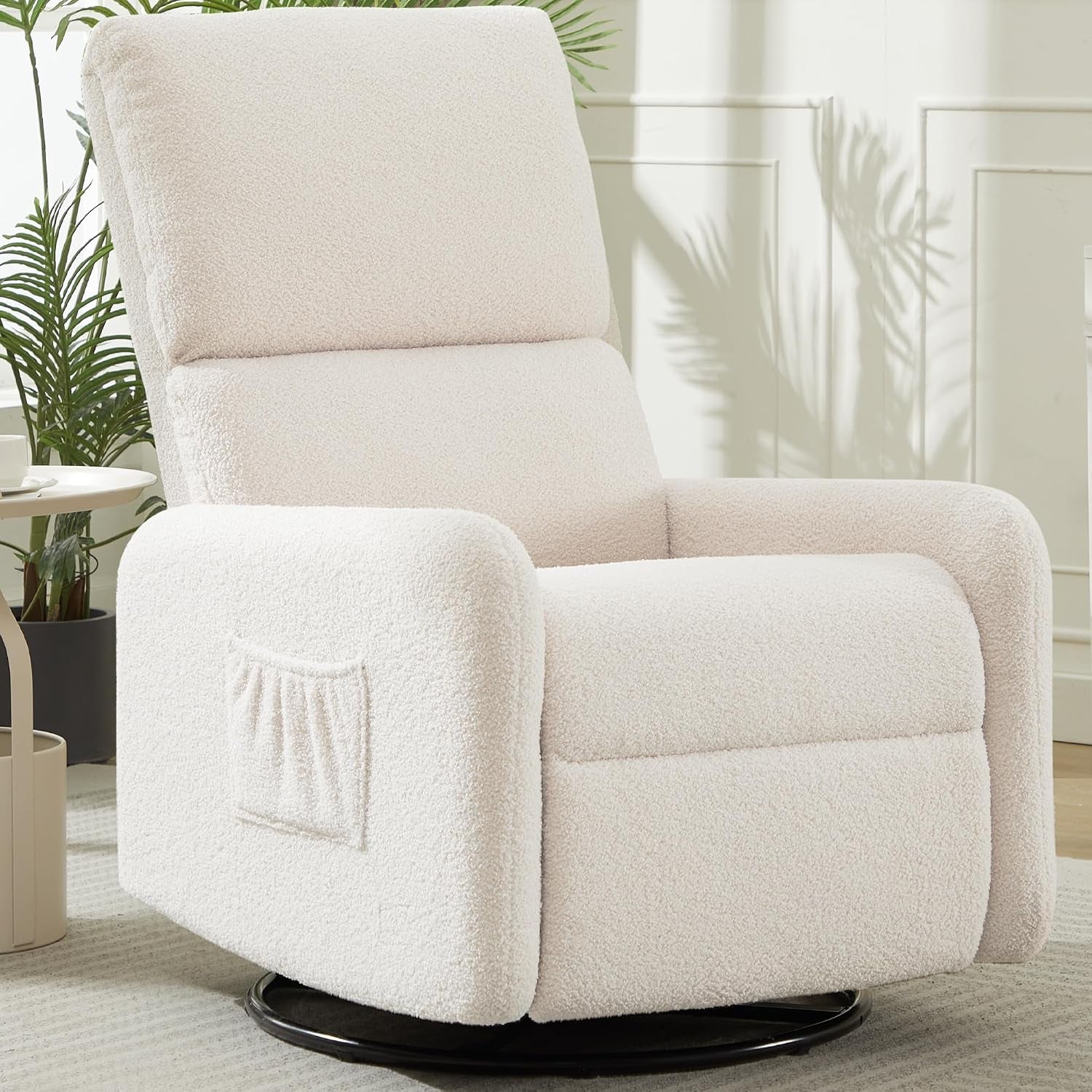 Ivory sherpa nursing rocker photographed from front-left showing plush arm and pocket