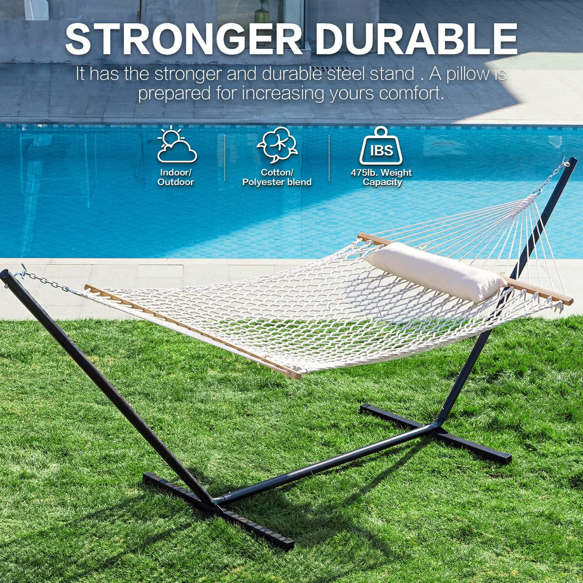 Natural net-style double hammock stretched on a black steel stand with hardwood spreader bars beside a pool