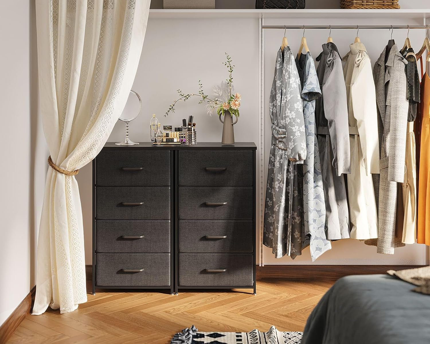 Two narrow fabric dressers side-by-side in a closet area showing storage setup