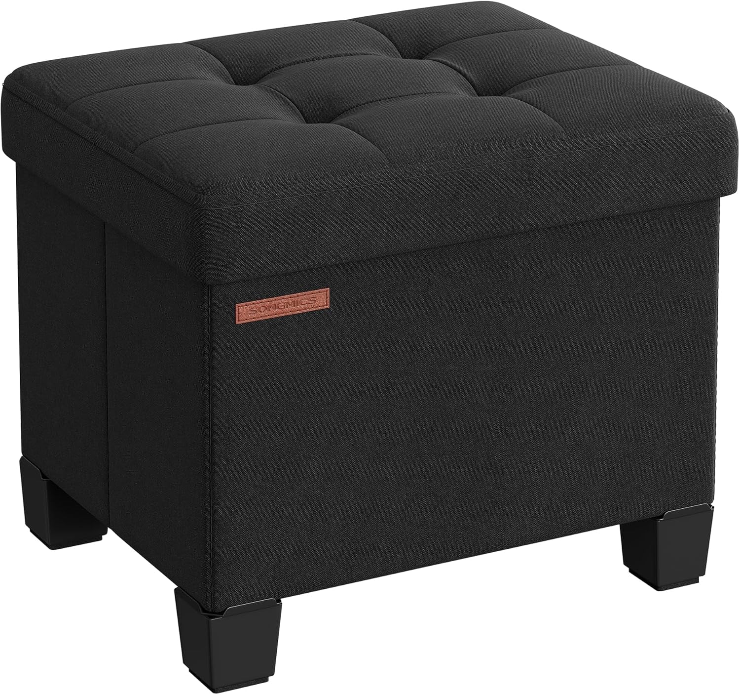 Front three-quarter view of a dark linen-look square storage ottoman with tufted top and four short black legs.