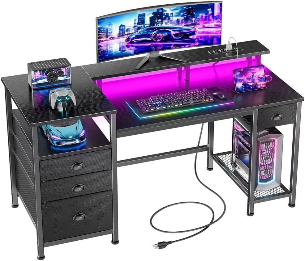 Black desk with curved ultrawide monitor, RGB-lit keyboard mat, toy car on left shelf and illuminated PC tower below.
