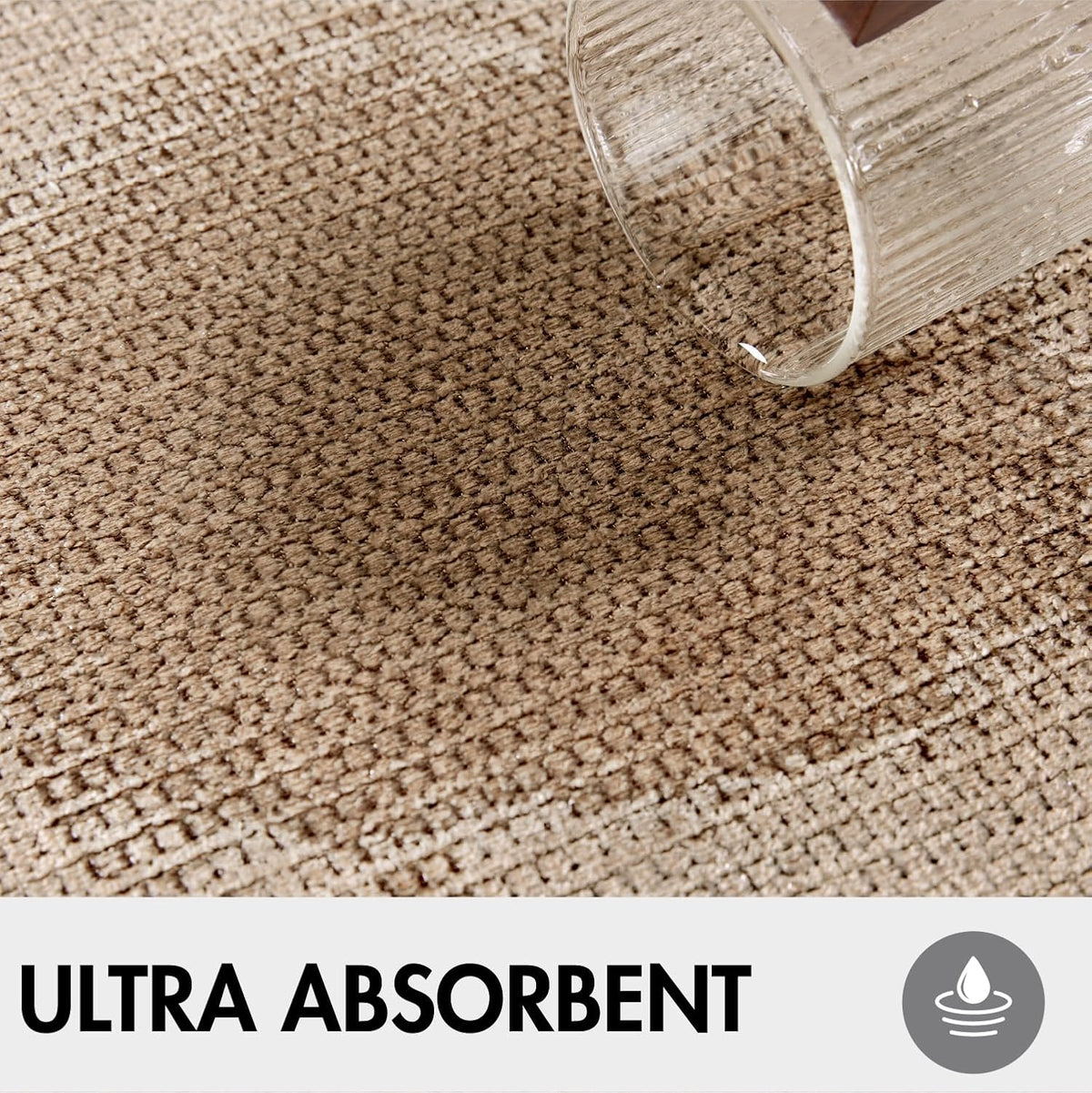 Close-up of beige terry cloth texture with water poured on the surface to show absorbency and woven detail