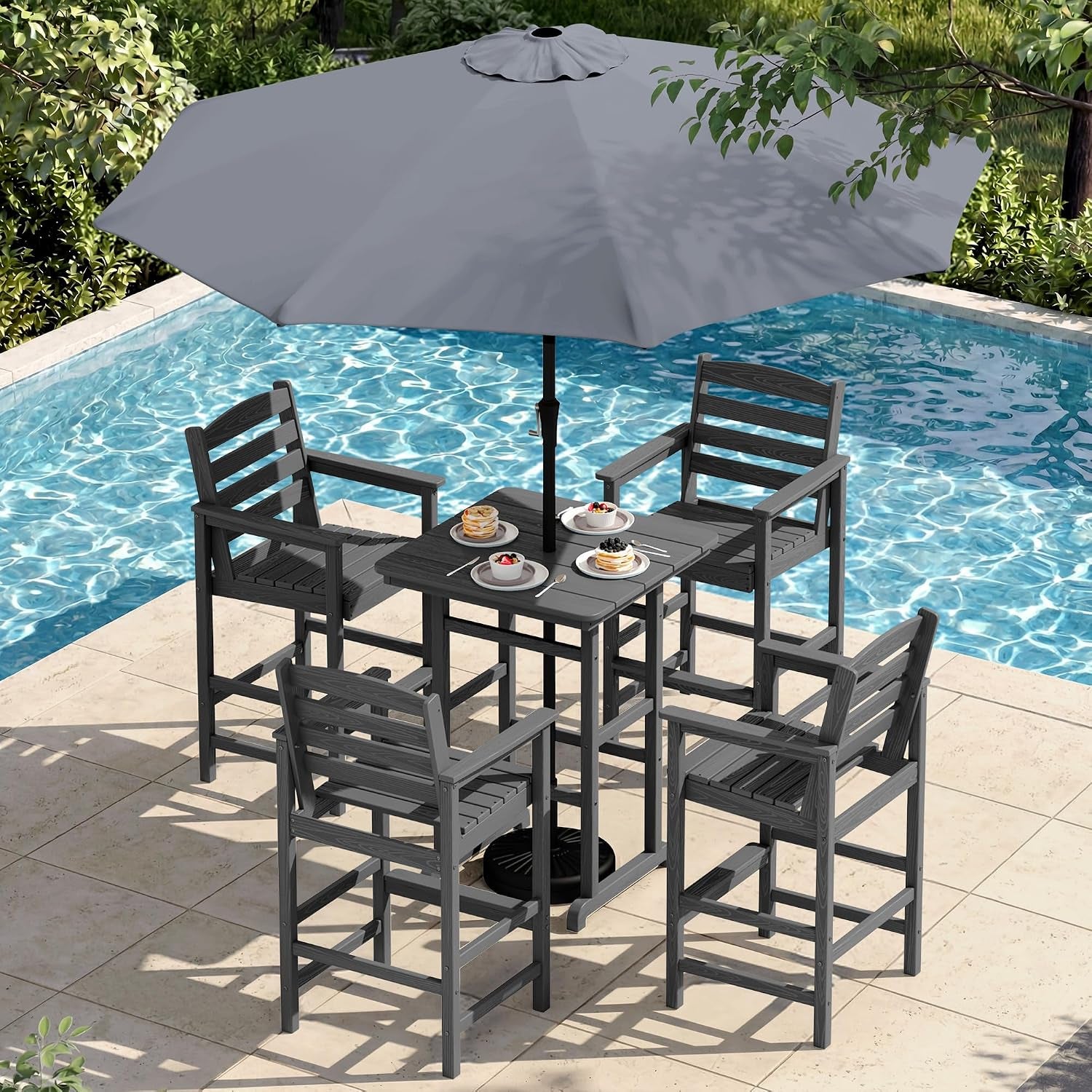 Dark gray bar-height table and four Adirondack-style bar chairs beside a pool under a large gray umbrella.