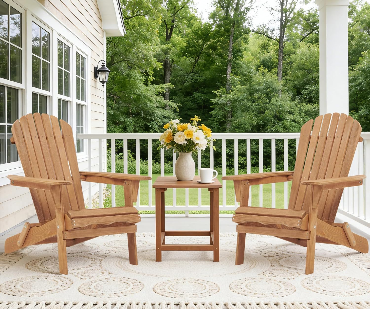 Two natural finish Adirondack chairs on a porch with a small side table holding a vase of flowers