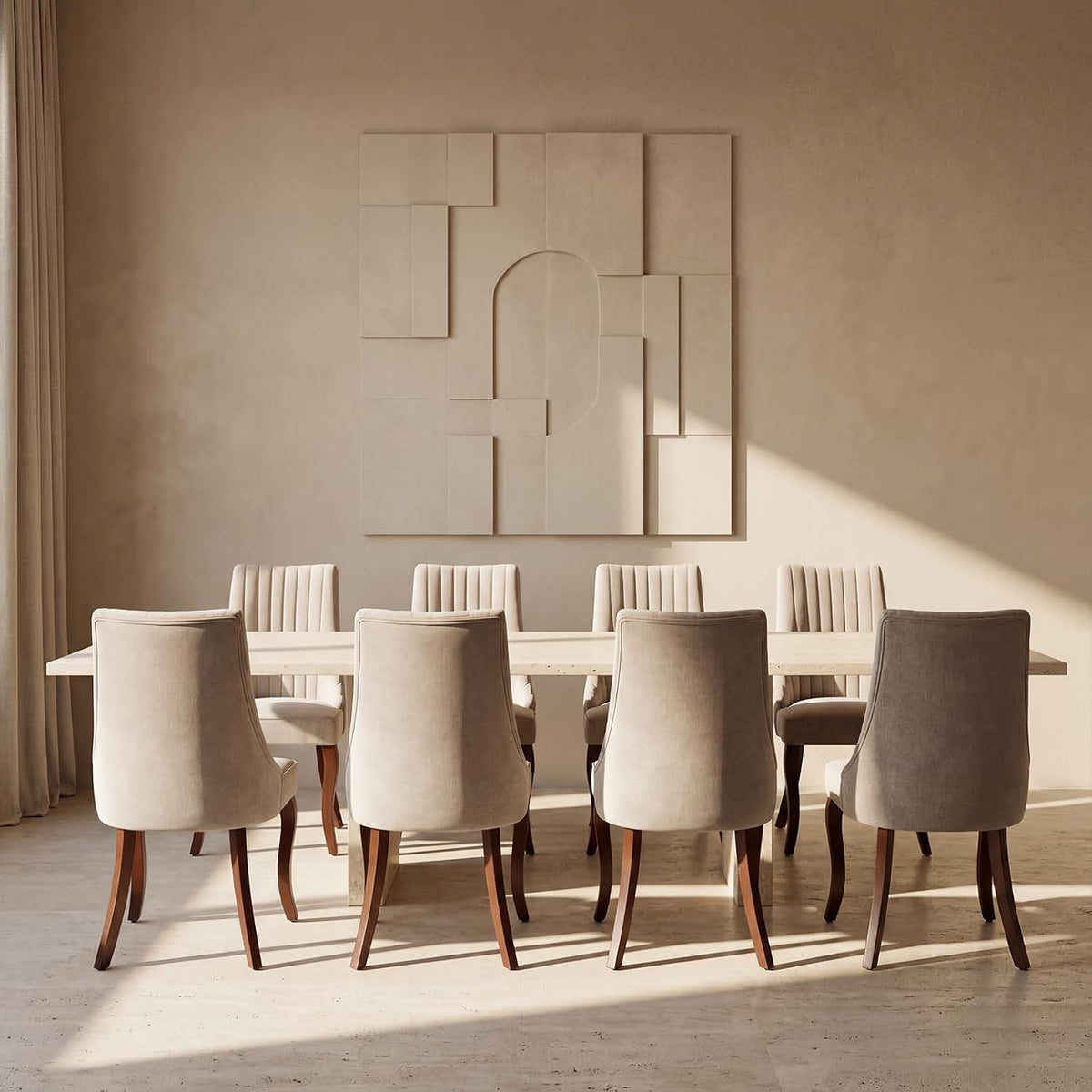Eight beige dining chairs arranged evenly around a long stone dining table in a neutral room