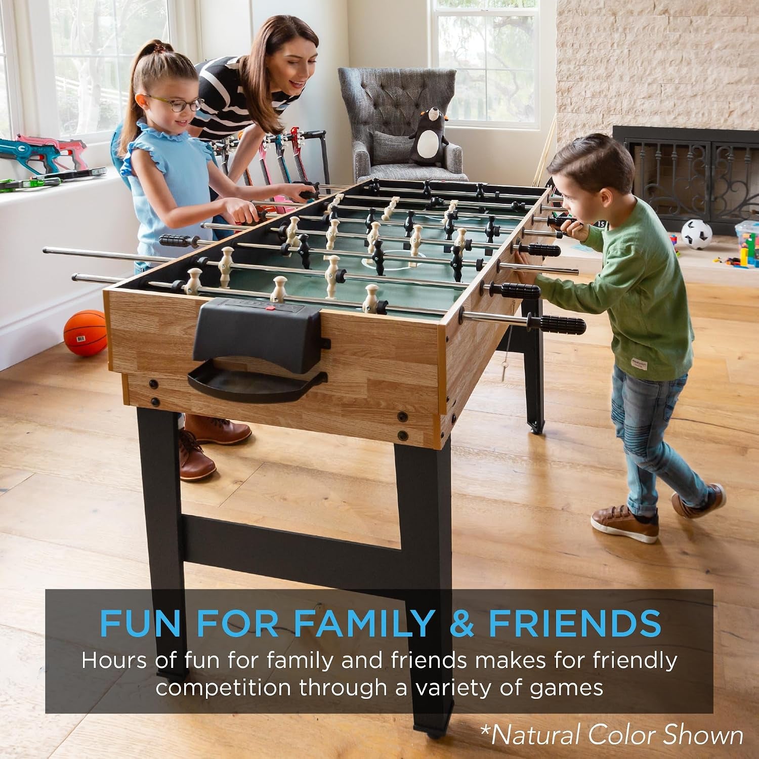 Natural finish foosball table in a bright family room with children and an adult playing