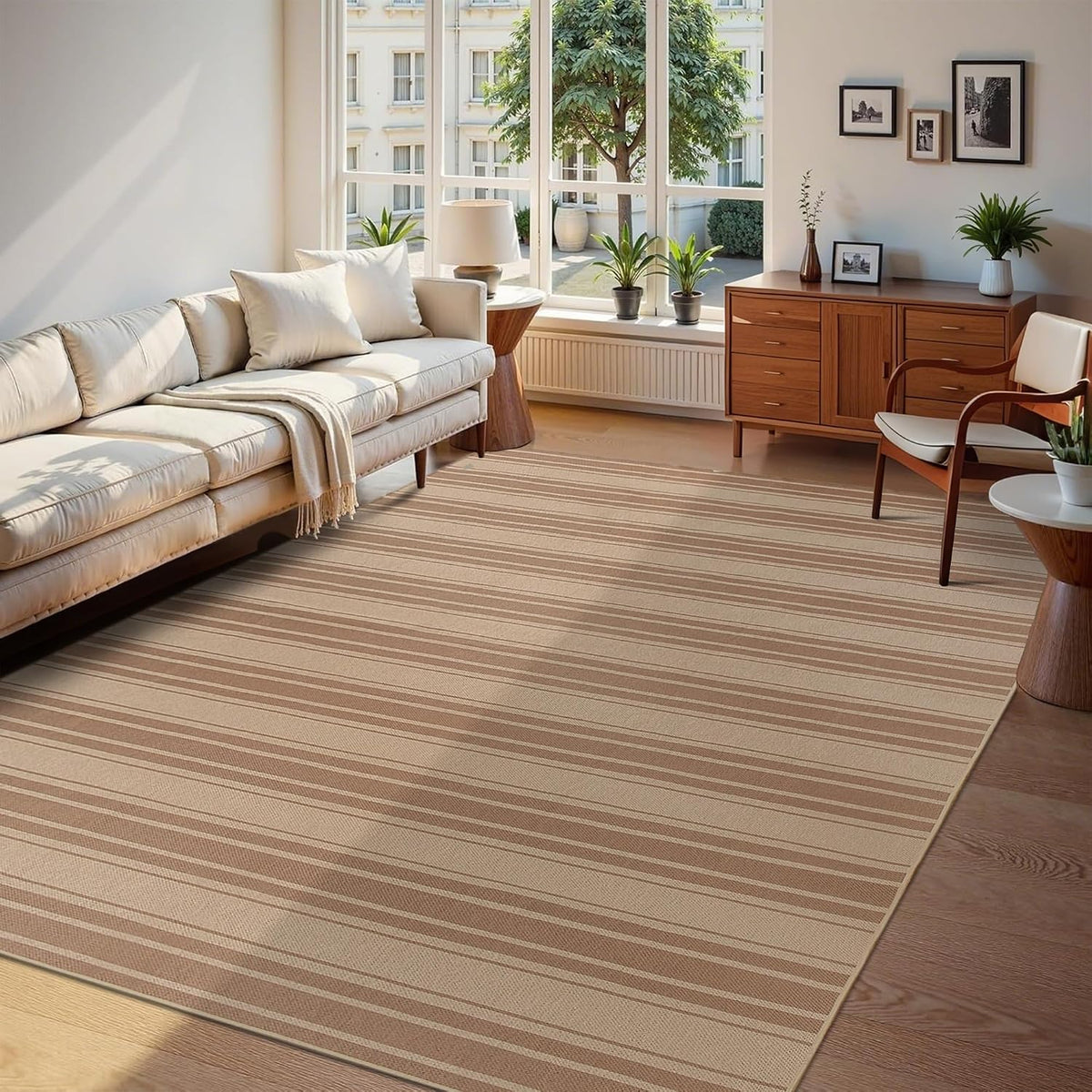 Wide living room angle showing a tan rug with subtle horizontal stripe bands.