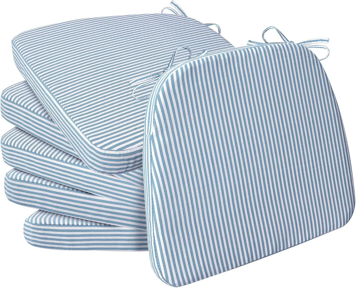 Stack of four thin blue-and-white striped D-shaped cushions with one propped upright in front