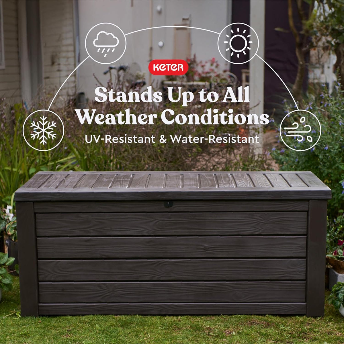 Front view of a closed brown outdoor storage box set on grass with garden backdrop