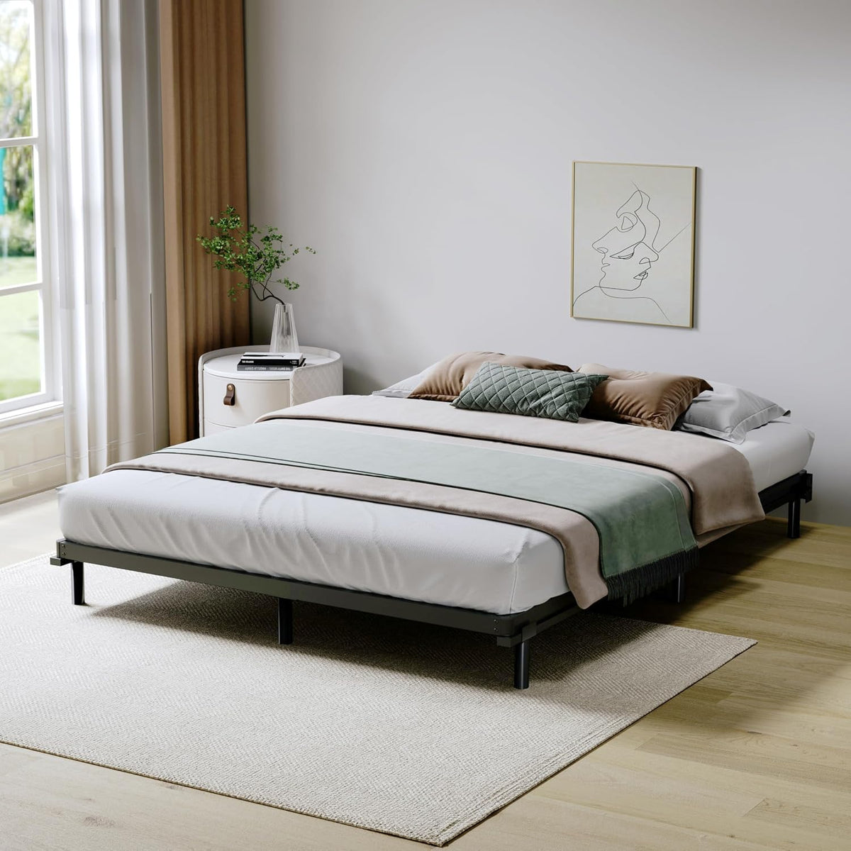 Bedroom scene with mattress and bedding supported by the low-profile metal box spring, side view
