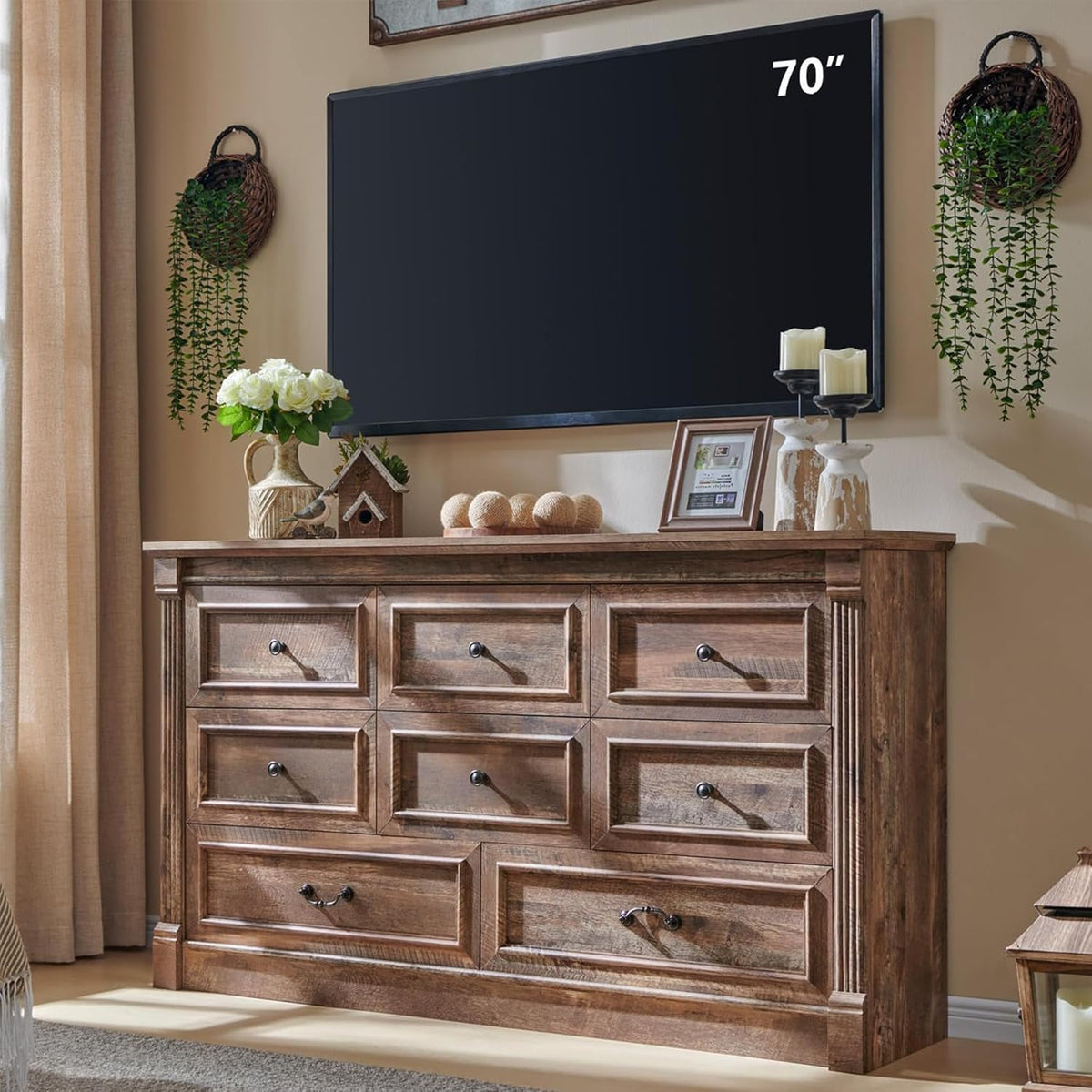 Seven-drawer rustic brown dresser with framed drawer fronts and column trim, topped with decor and TV above.
