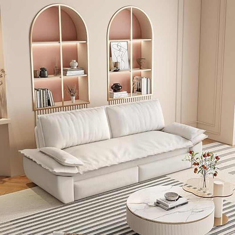 Beige corduroy sofa displayed in a softly lit living room with arched wall shelves