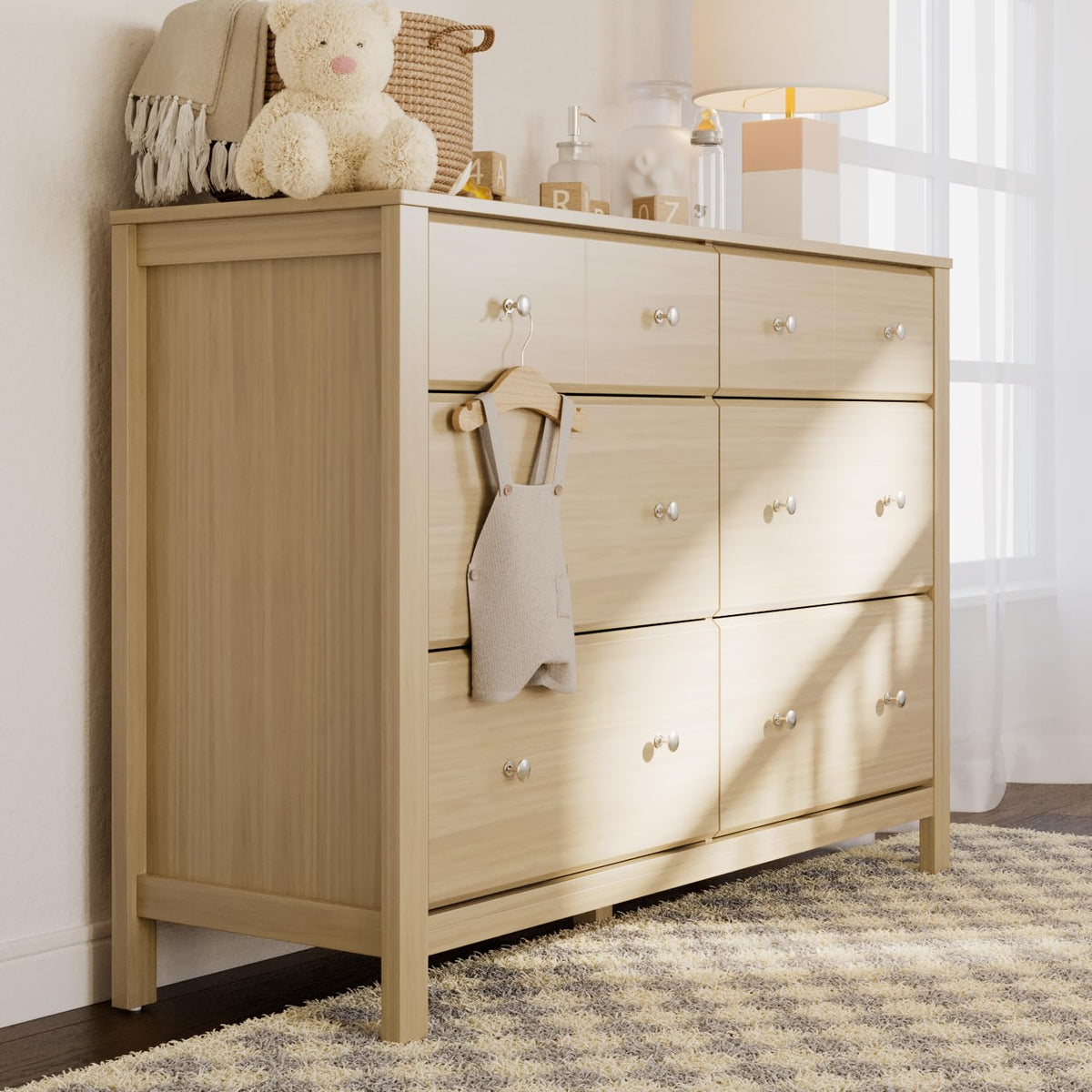Side-angle view of light wood finish dresser in a softly lit room with a rug at the base