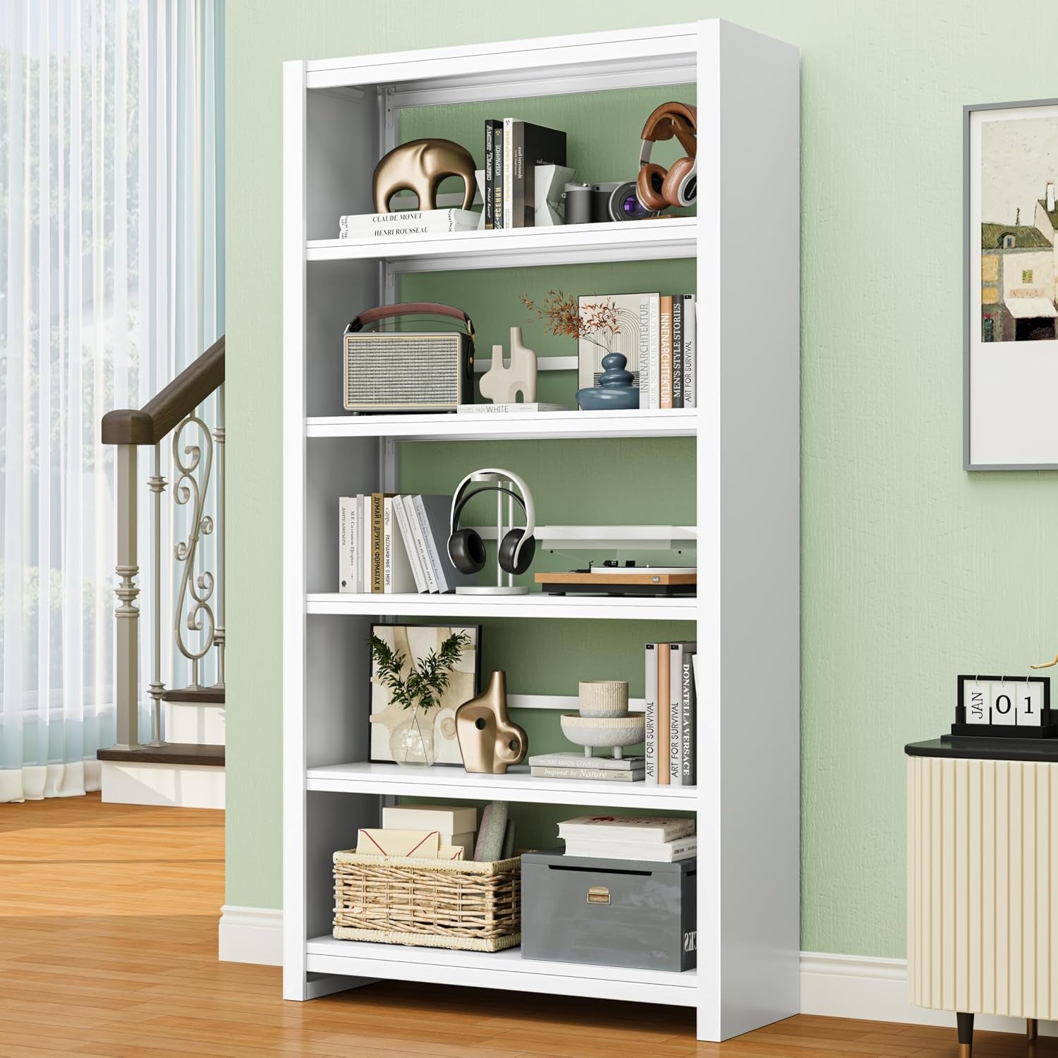 Close three-quarter view of a white media cabinet showing adjustable shelves arranged with headphones, books and decorative