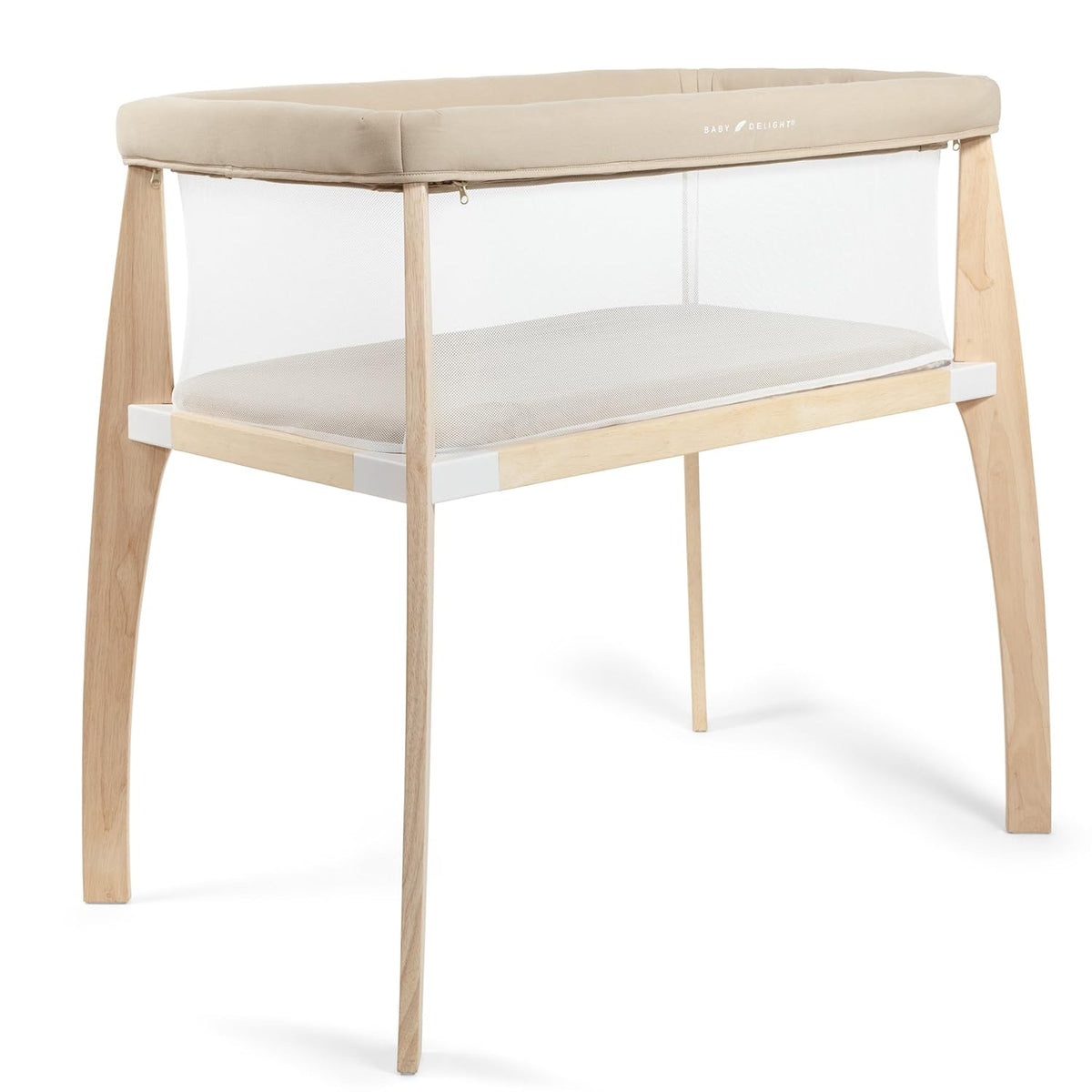 Beige bedside bassinet with mesh sides and light wood arched legs on a white background.