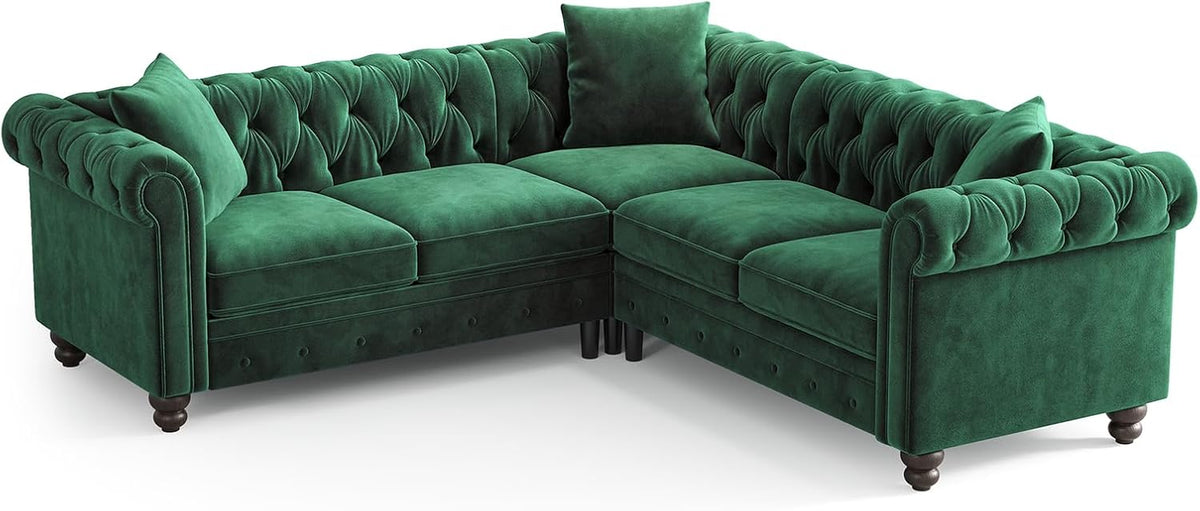 Isolated studio shot of the green Chesterfield L-shaped sectional showing tufted back and turned legs