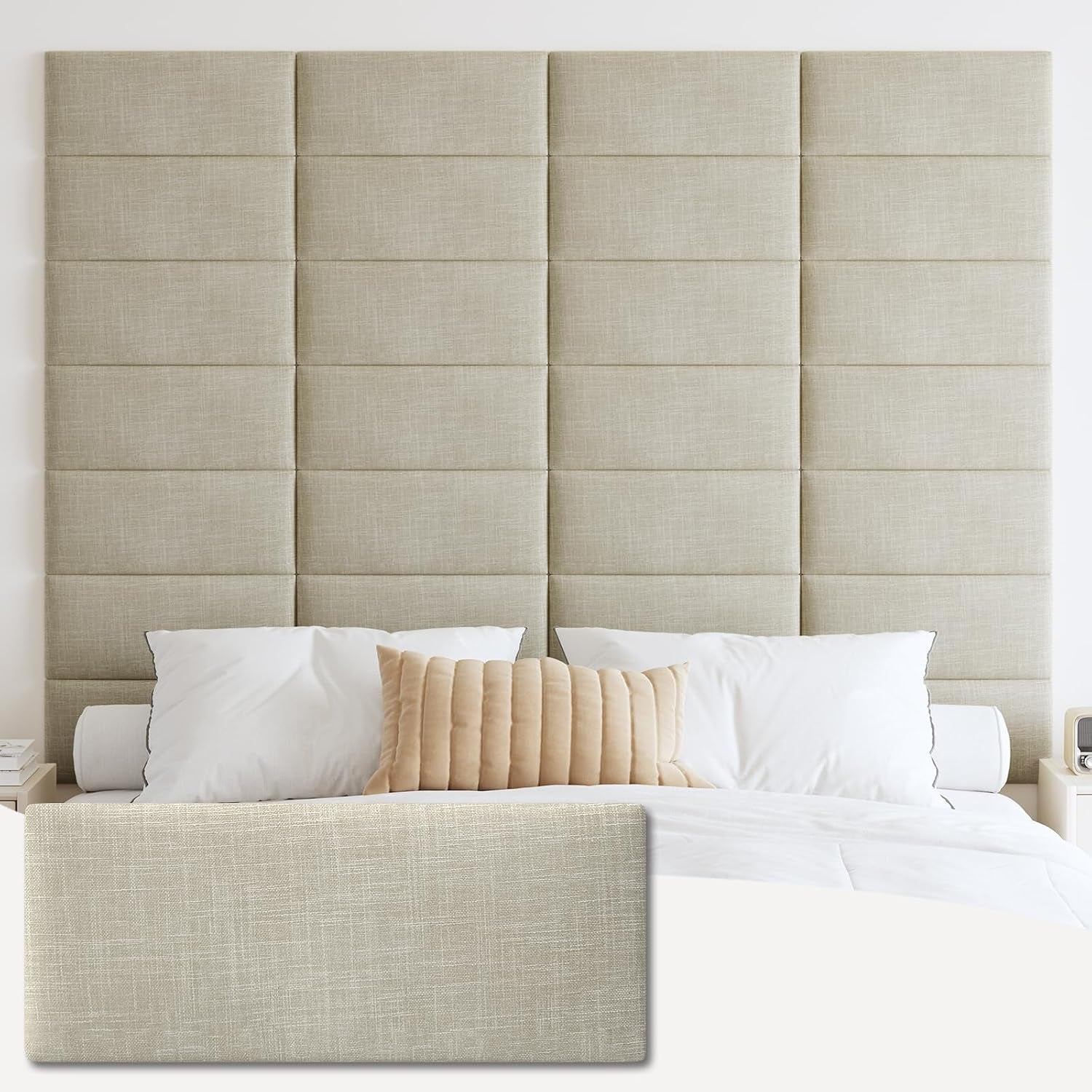 Tall grid of tufted rectangular panels in a light beige fabric behind a bed with white pillows and a tan lumbar pillow.