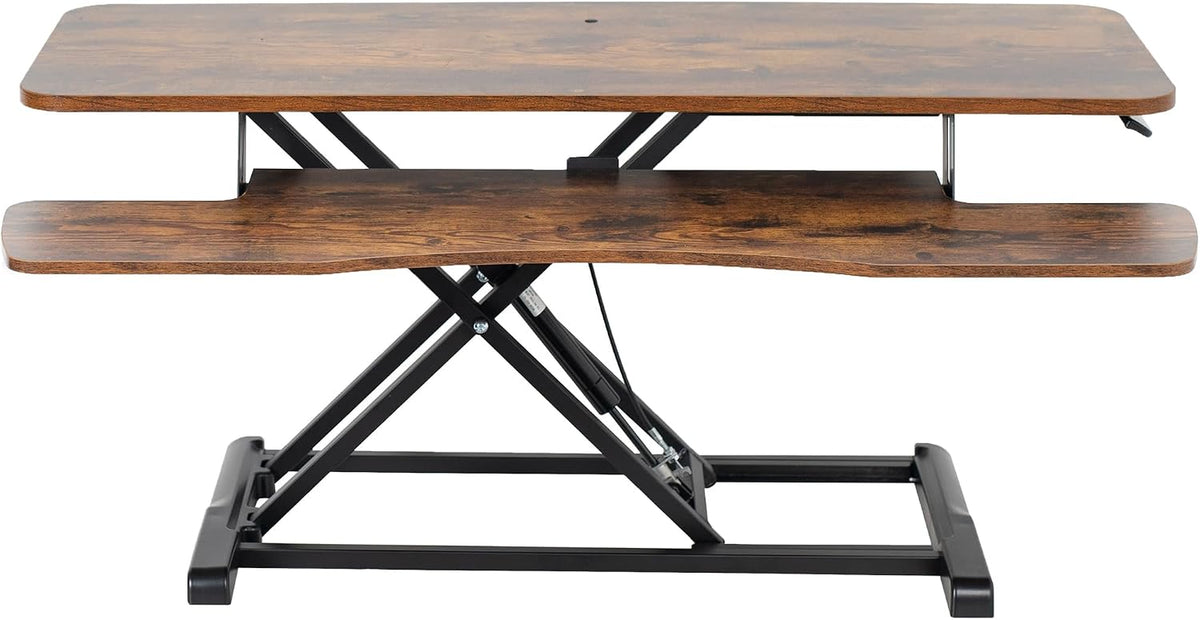 Front view of the wood-grain desk converter showing the scissor lift frame and curved keyboard tray