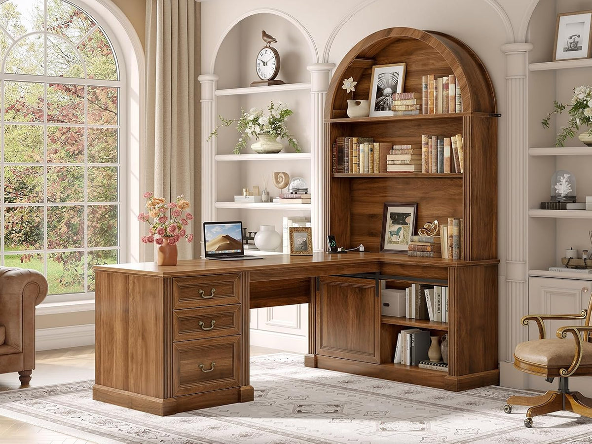 Warm wood L-shaped desk paired with a tall arched five-tier bookshelf in a windowed study.