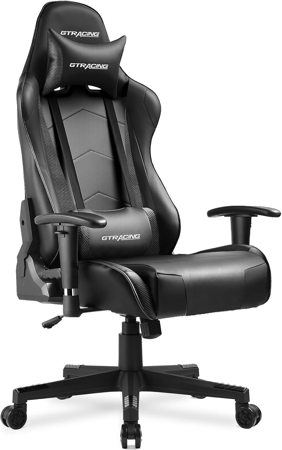 All-black racing-style gaming chair at a three-quarter angle with matching pillows and adjustable armrests.