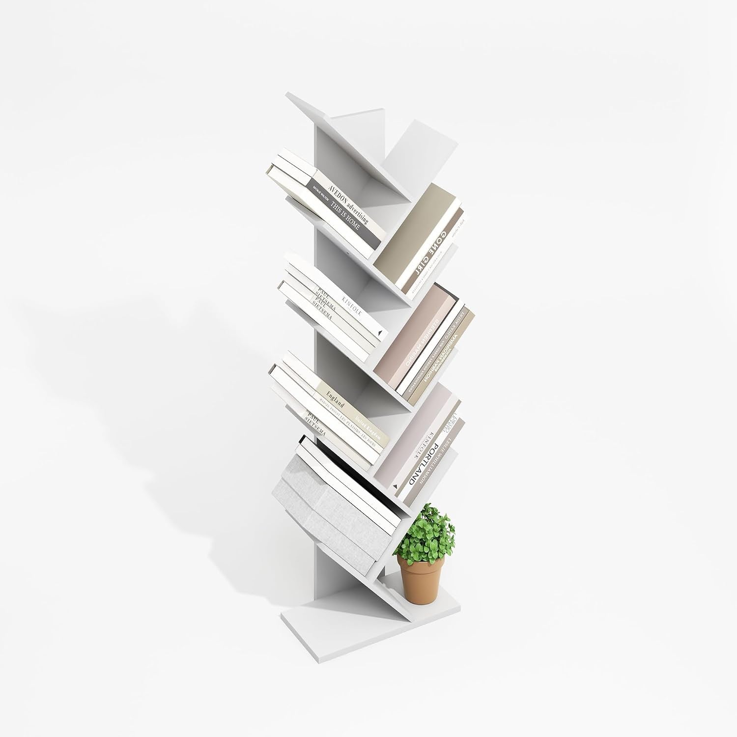 White zigzag vertical bookshelf with alternating angled cubbies holding books and a small potted plant on a white background.