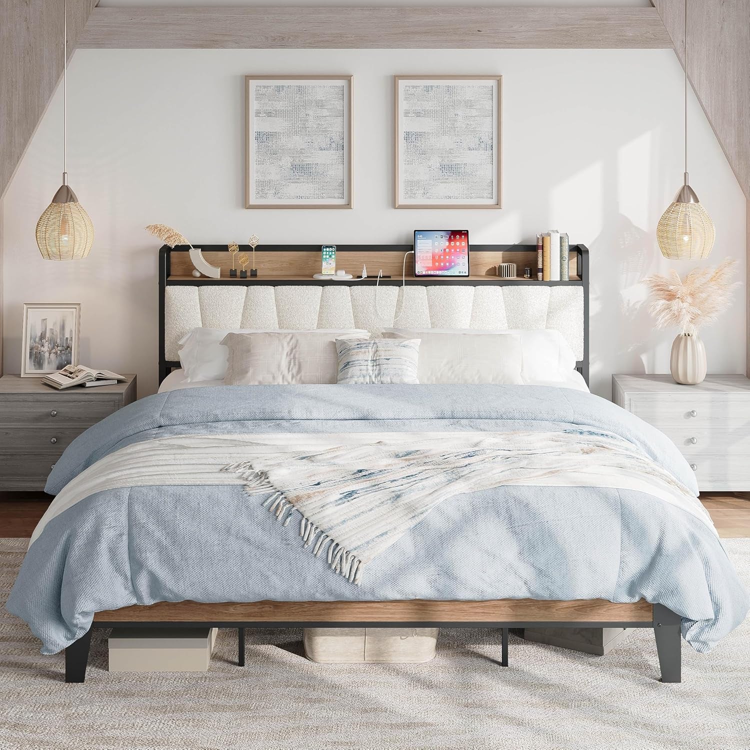 Front view of a bed with light blue bedding, cream textured headboard and black frame with wood trim under sloped ceiling.