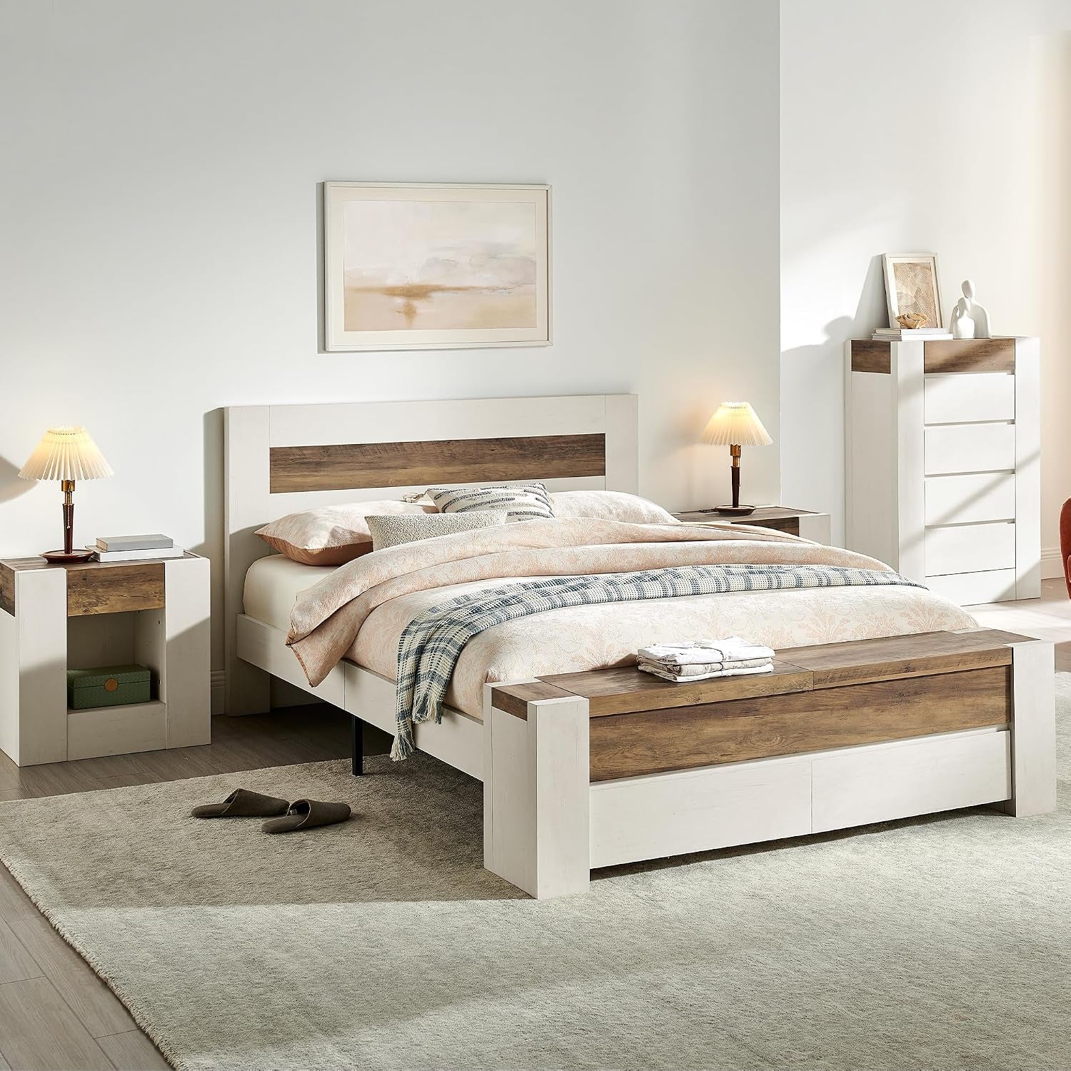 Bedroom scene with a white platform bed featuring a wood-accent headboard and storage bench at the foot.