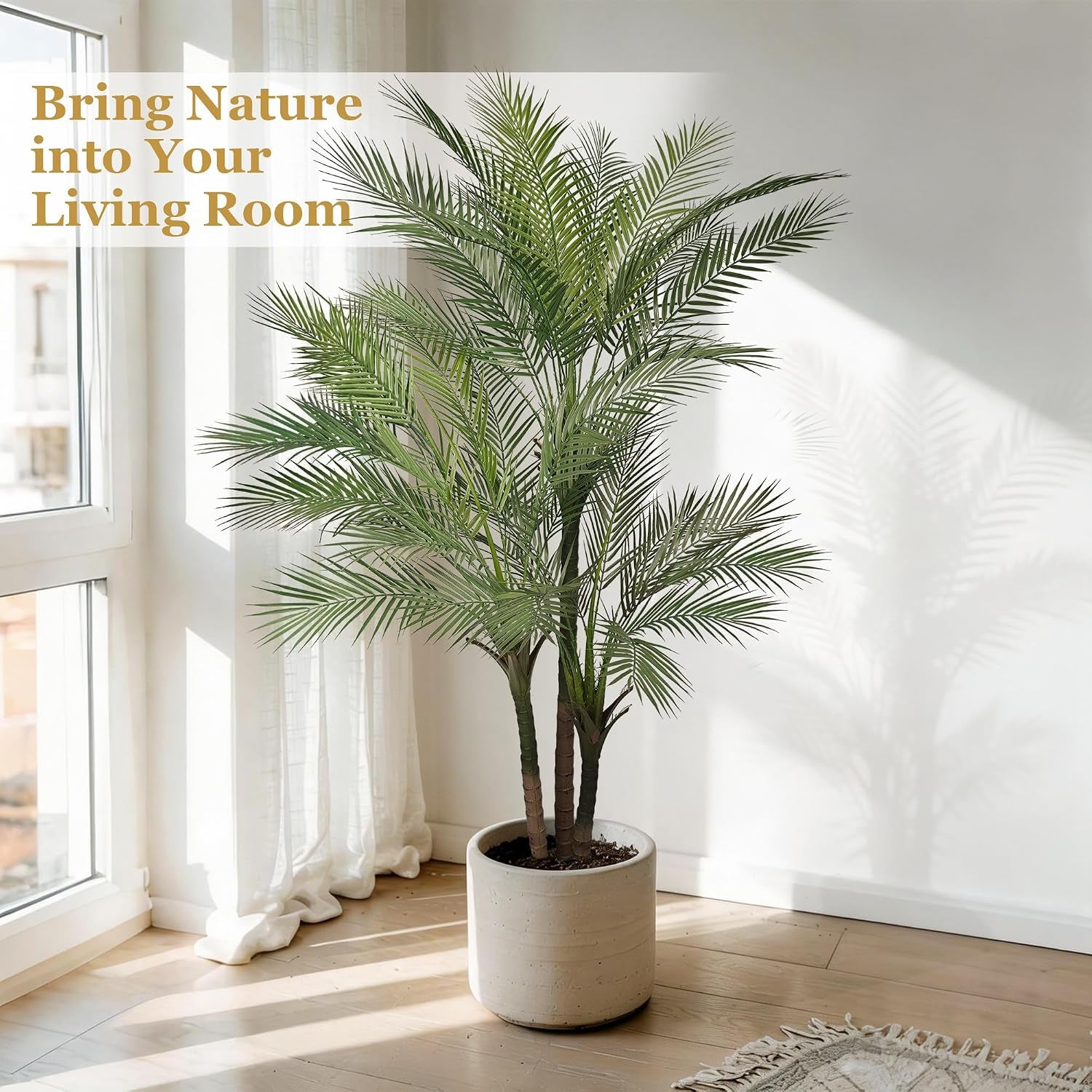 Golden cane palm tree styled in a light living room corner inside a round beige planter