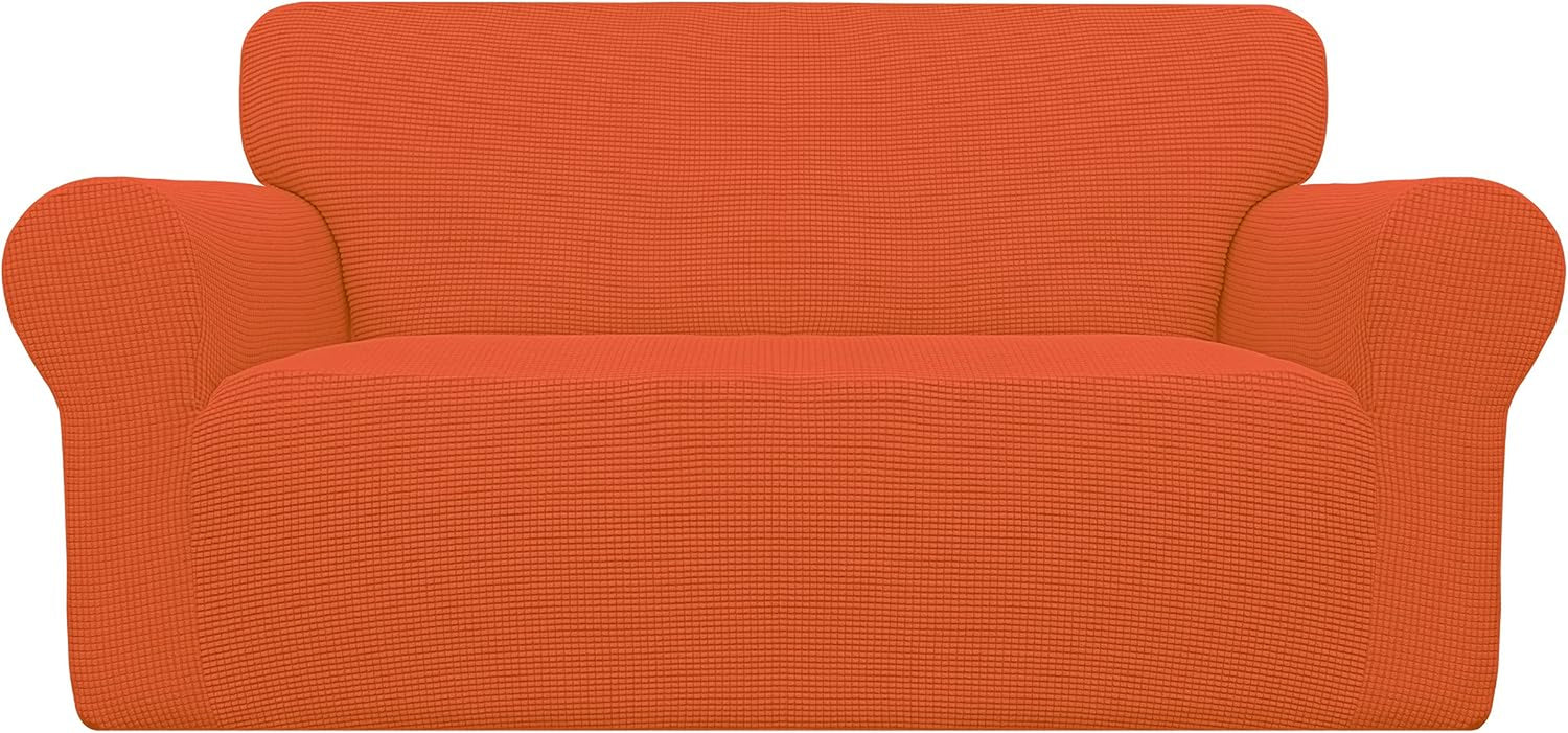 Front studio shot of an orange textured loveseat cover centered on a white background.