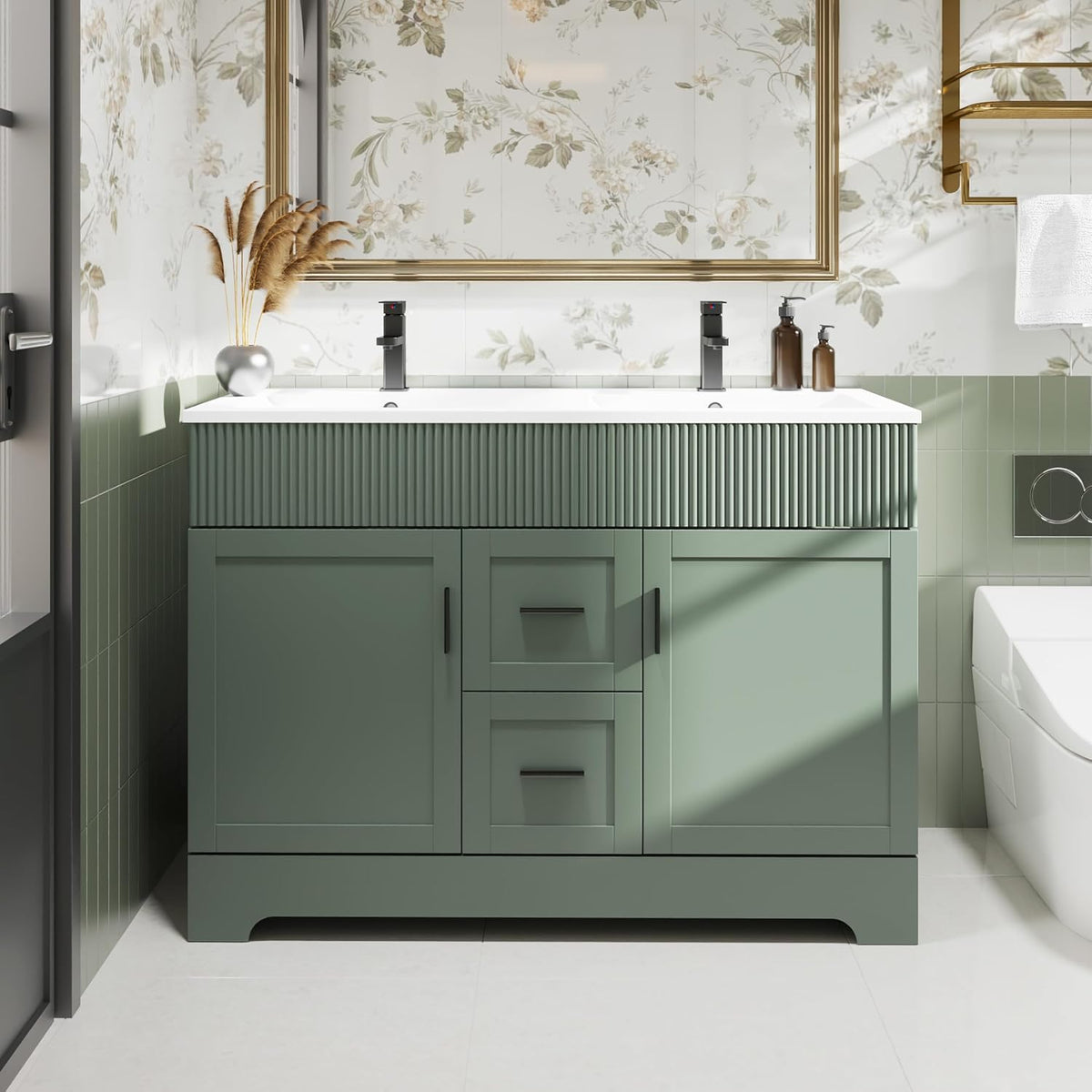 Close front view of a green vanity showing ribbed upper trim, black faucets and centered drawers